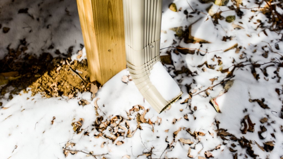 Gutter downspout in winter
